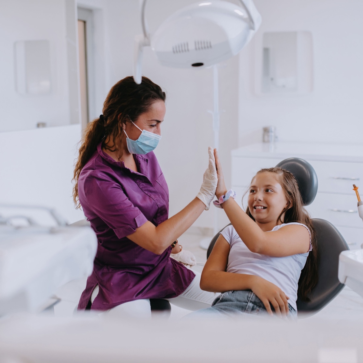 A dentist with a young patient